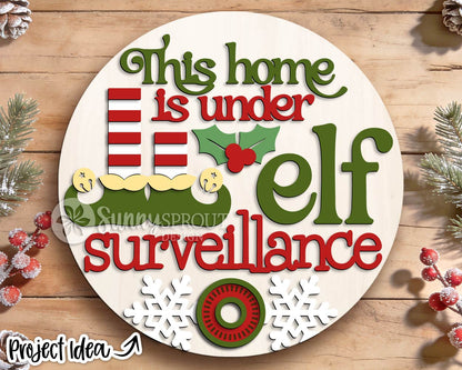 This Home Under Elf Surveillance Sign, Digital Download, SVG Laser Cut File, Cricut, Round Door Hanger Design, Funny Christmas Decor