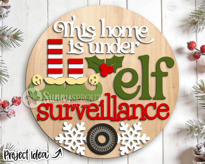 This Home Under Elf Surveillance Sign, Digital Download, SVG Laser Cut File, Cricut, Round Door Hanger Design, Funny Christmas Decor